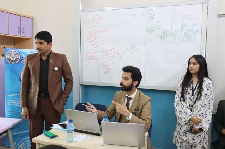 Chairs leading a committee session at the whiteboard